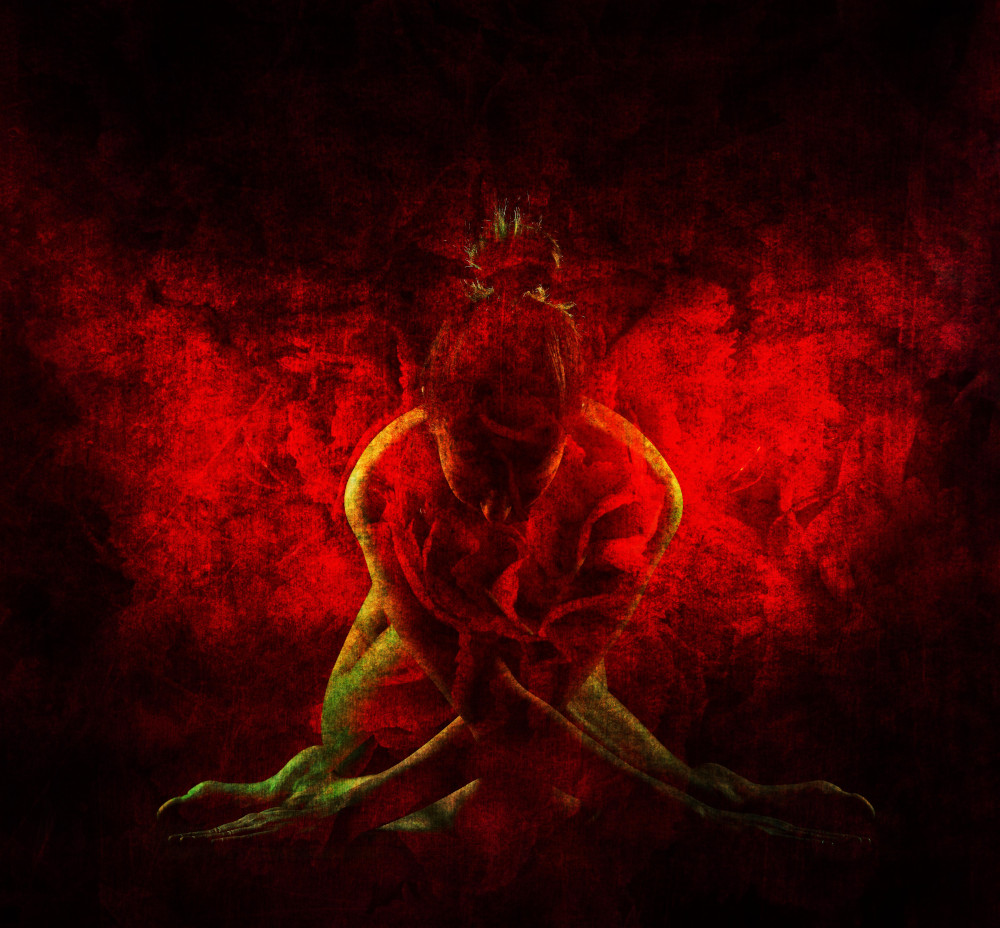 A red and black painting depicting a woman seated on the ground, conveying a sense of contemplation and solitude.